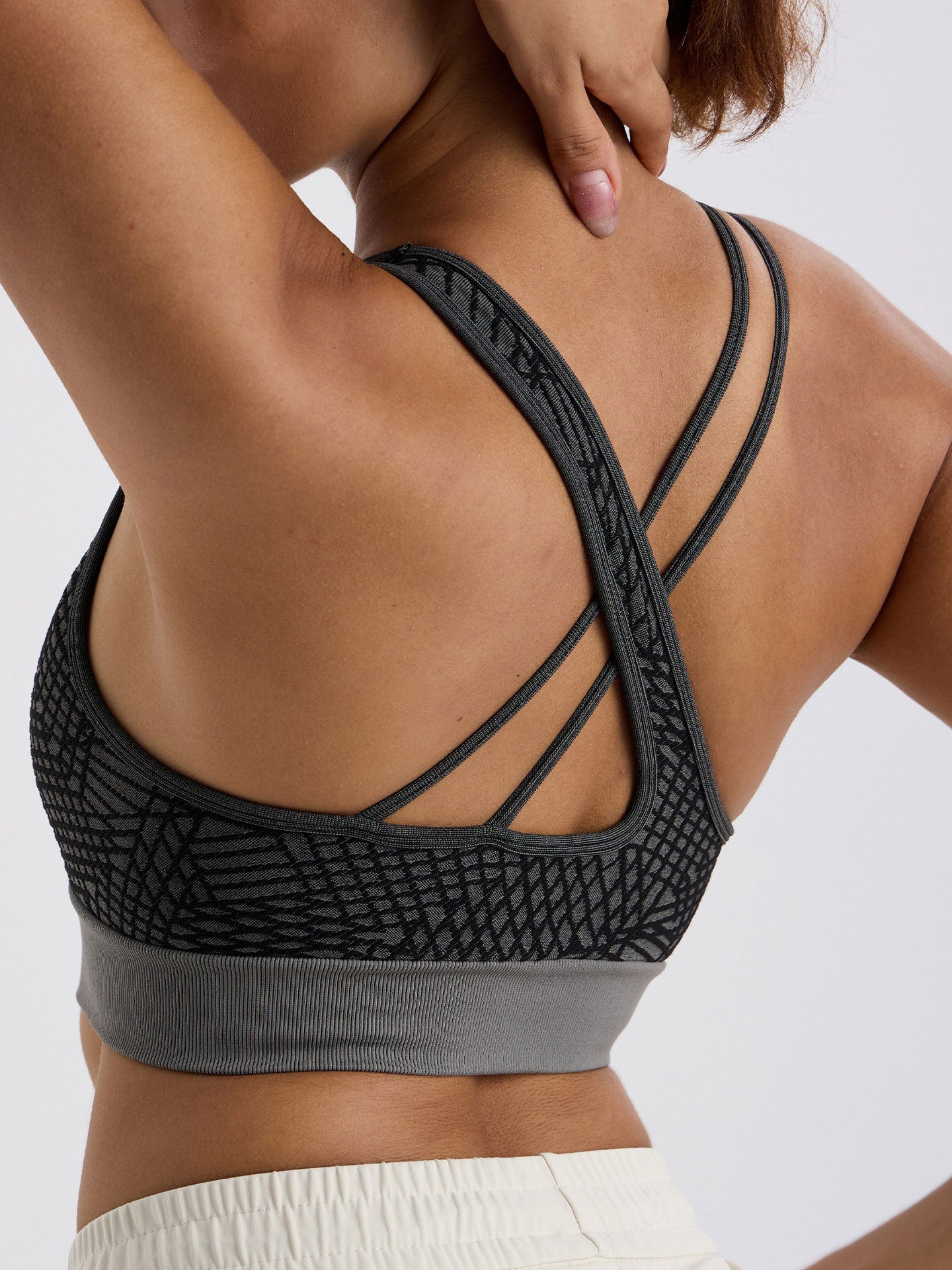 Asymmetrical shoulder strap sports bra