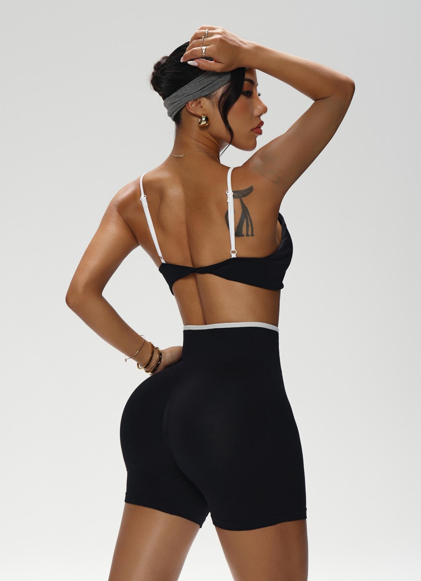 Lila Zen Color-blocked knotted backless bra and high-waisted yoga shorts two-piece set