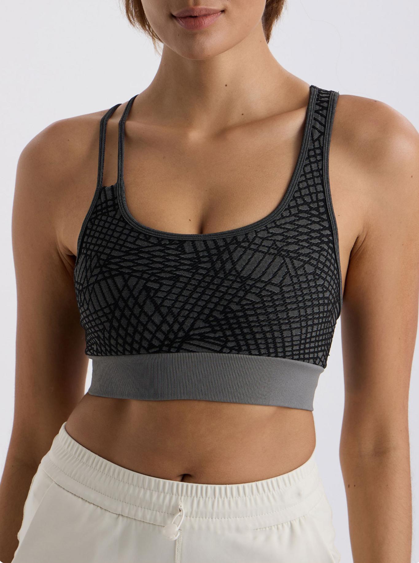 Asymmetrical shoulder strap sports bra