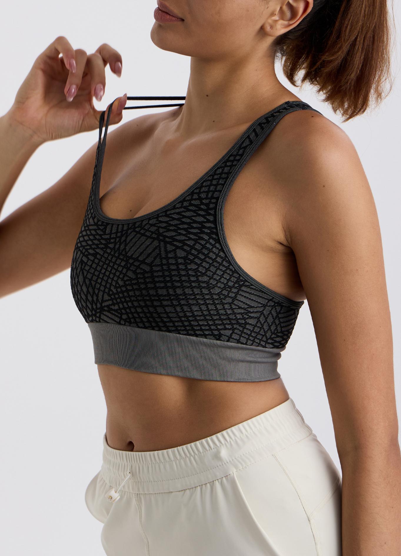 Asymmetrical shoulder strap sports bra