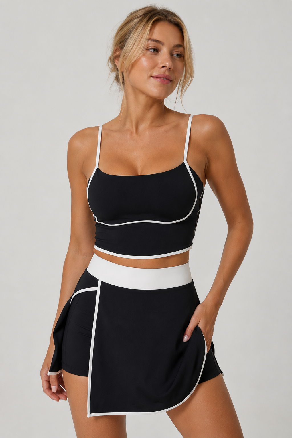 Lila Zen Women's color-blocked two-piece workout outfit, including a tennis skirt and a backless bra