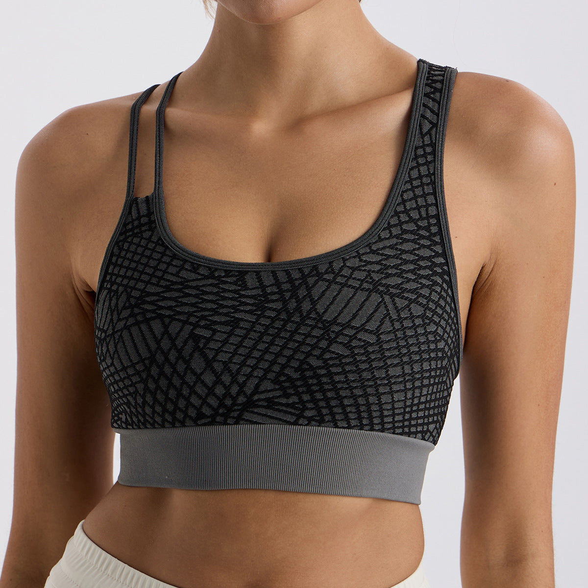 Asymmetrical shoulder strap sports bra