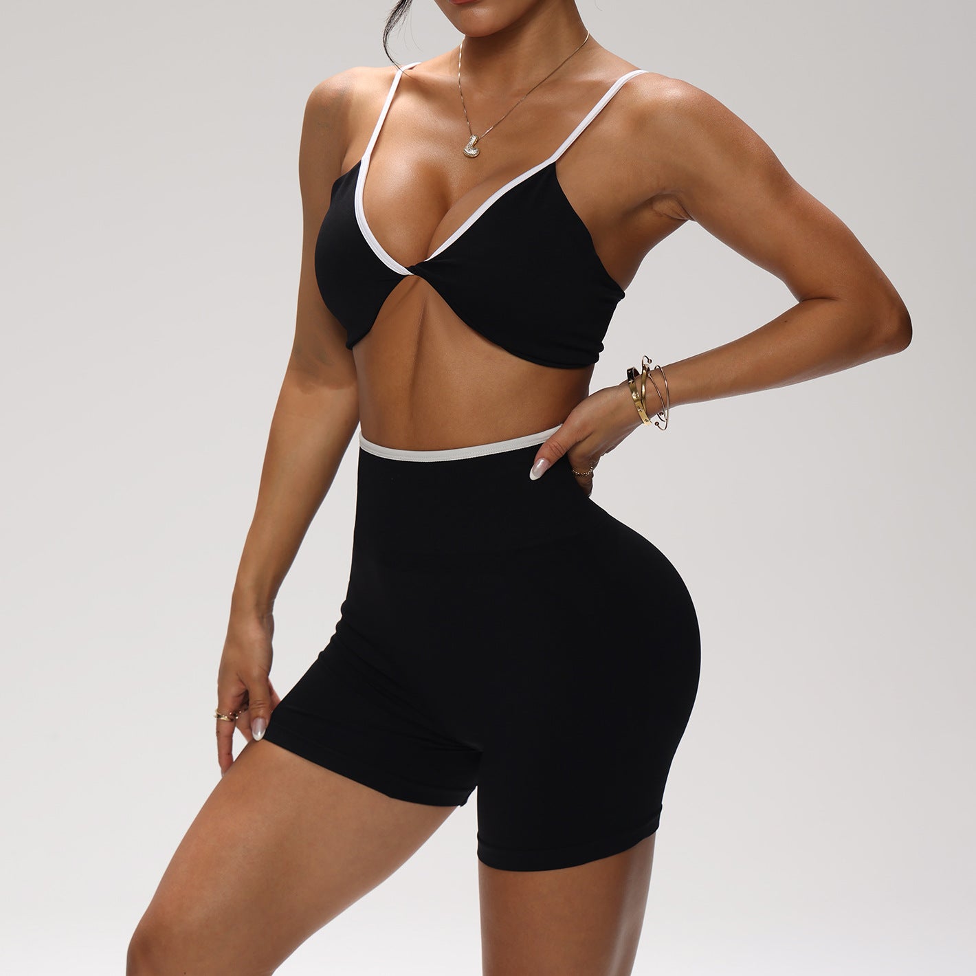 Lila Zen Color-blocked knotted backless bra and high-waisted yoga shorts two-piece set